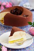 Elegant chocolate souffle cake covered with chocolate velor, photo
