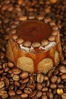 Yummy chocolate cake on coffee beans background photo