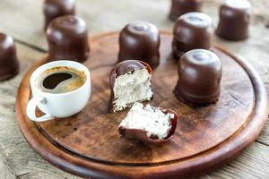 Fresh marshmallows with cup of coffee photo