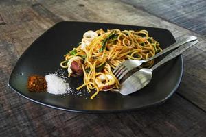 Spaghetti with shrimps, squid. photo