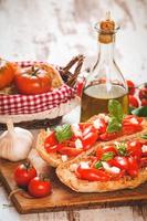 Italian starter, bruschetta with Sicilian red fresh tomato and m photo