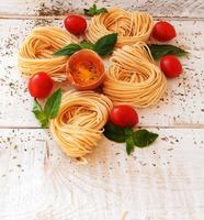 raw egg and noodles with spices photo