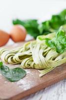 Homemade tagliatelle with spinach photo