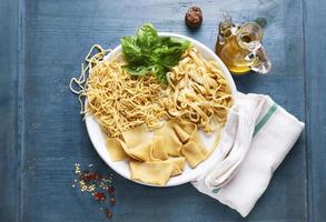 various types of Homemade Fresh Pasta on the plate photo