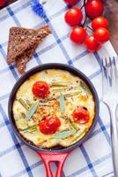 Omelette with cherry tomatoes photo