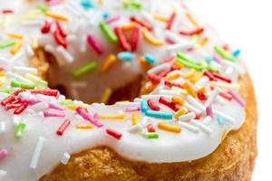 Fresh donut decorated with colored sprinkles