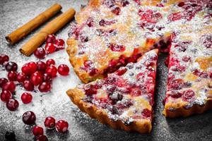 Closeup Cranberry pie on gray background photo