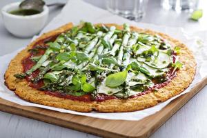 Cauliflower pizza with zucchini and asparagus photo