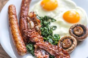 Fried eggs with bacon photo