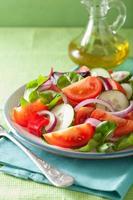 healthy tomato salad with onion cucumber pepper photo