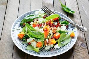 salad with celery and pumpkin, spinach