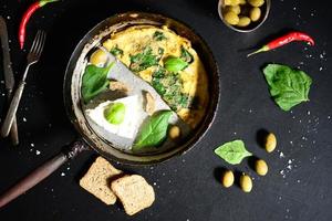 Fresh white cheese with scrambled eggs and spinach photo