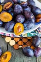fresh juicy plums on a wooden board