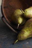 Three pears on grunge background. photo
