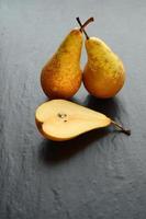 Fresh organic pears on stone table. Pear autumn harvest