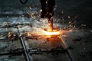 Industrial Laser cutting metal with sparks