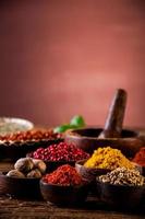 Hot spices in wooden bowls photo