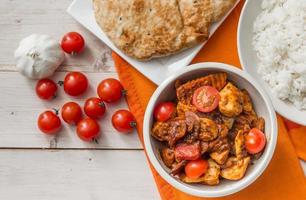Indian chicken jalfrezi with basmati rice and naan