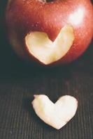 Apple with a heart cut into it