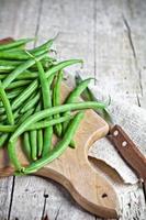 green string beans and knife