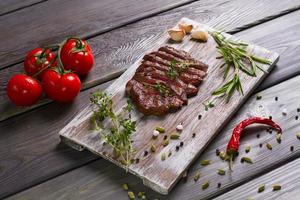Delicious beef steak with tomato.