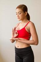 calm, peaceful fitness woman practicing yoga meditation photo