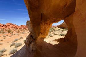Desert Landscape Framed by Rock Formation photo