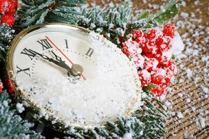Christmas clock with winter decoration photo
