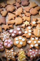 Colorful Christmas gingerbread cookies on baking paper
