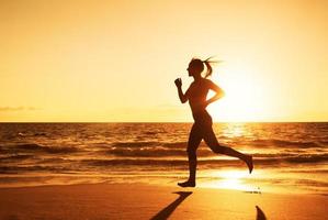 Woman Running at Sunset photo