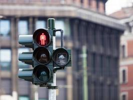 Traffic light with red light in Milan photo