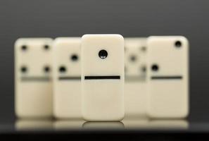 White dominoes showing leader or winner