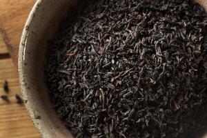 té negro seco de hojas sueltas foto