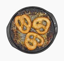 Soft pretzels salted on pan