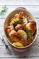 Roasted chicken drumsticks with apples photo