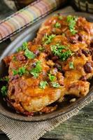 Chicken legs baked with red bean and tomato sauce photo