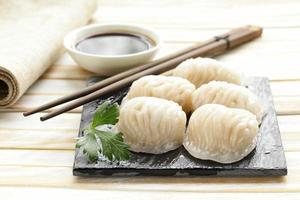 Asian steamed meat dumplings dim sum with soy sauce photo
