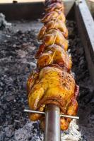 Grilled chicken in street market photo