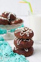 Chocolate donuts with white icing photo
