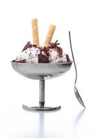 stracciatella ice cream sundae in classical metal pot with spoon