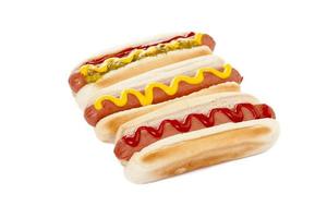 three hot dog sandwiches photo