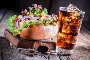 Tasty hot dog with cold drink photo