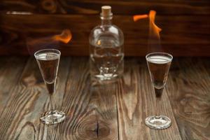 Shot glasses with alcohol on fire