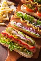 grilled hot dogs with vegetables ketchup mustard photo