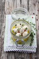 In olive oil marinated mozzarella with thyme