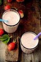 Healthy nutritious tropical smoothie with strawberries photo
