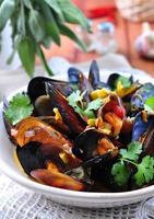 soup of wild mussels with white wine, vegetables, sage, coriander