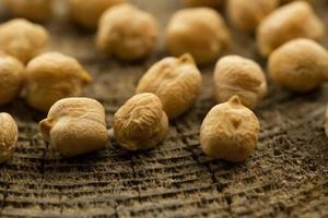 bunch of chickpeas on the old wooden background. Indian cuisine photo