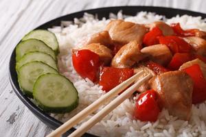 rice with chicken and vegetables close-up. horizontal photo