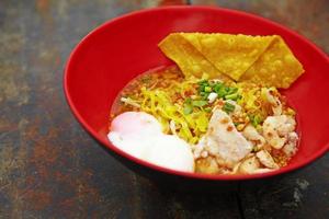close up thai spicy pork noodle photo